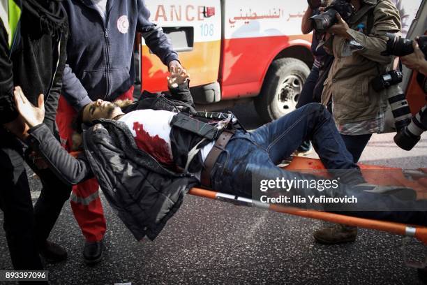 Man with a device attached to his body is carried on a stretcher after being shot by soldiers after he went on a stabbing attack in the area on...