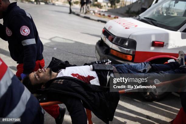 Man with a device attached to his body is carried on a stretcher after being shot by soldiers after he went on a stabbing attack in the area on...