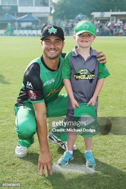 Marcus Stoinis of the Stars poses with a fan during the Twenty20 BBL practice match between the Melbourne Stars and the Hobart Hurricanes at...