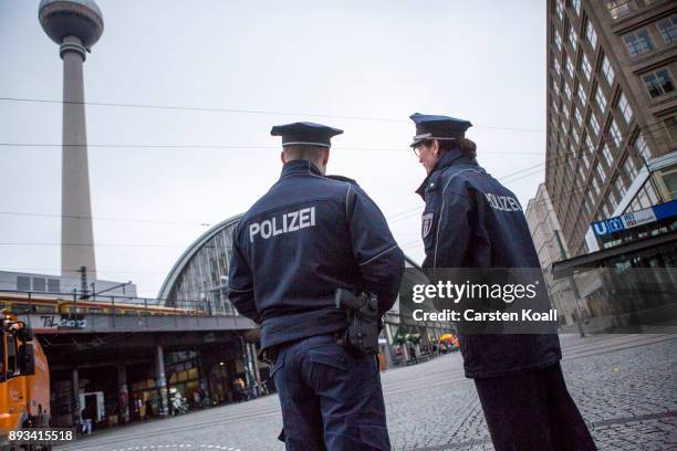 Police walk for the press during a media event at the Alexanderplatz shortly after the inauguration of a new police station at Alexanderplatz on...