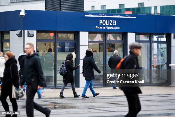 Passers-by pass a new police station at Alexanderplatz on December 15, 2017 in Berlin, Germany. Alexanderplatz, at the heart of Berlin, has seen a...