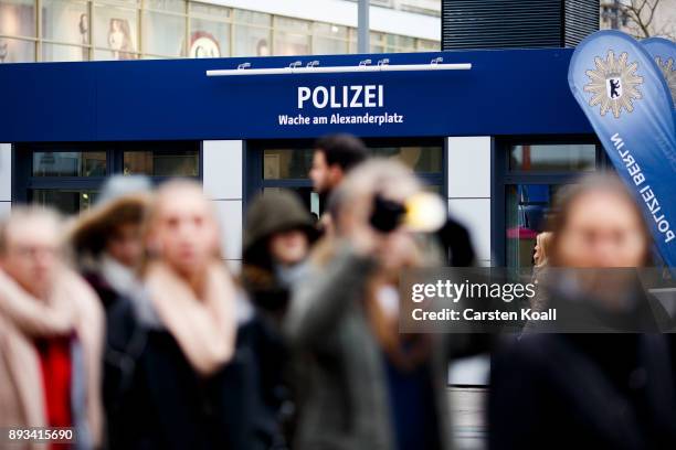 Passers-by pass a new police station at Alexanderplatz on December 15, 2017 in Berlin, Germany. Alexanderplatz, at the heart of Berlin, has seen a...