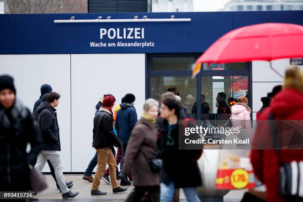 Passers-by pass a new police station at Alexanderplatz on December 15, 2017 in Berlin, Germany. Alexanderplatz, at the heart of Berlin, has seen a...