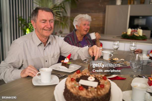 christmas in glr - seniors enjoying advent with coffee and cakes - st nicholas stock pictures, royalty-free photos & images
