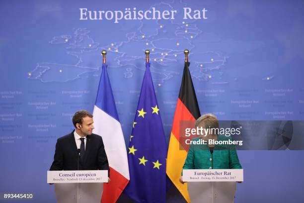 Angela Merkel, Germany's chancellor, right, speaks as Emmanuel Macron, France's president, looks on during a news conference at a summit of 27...