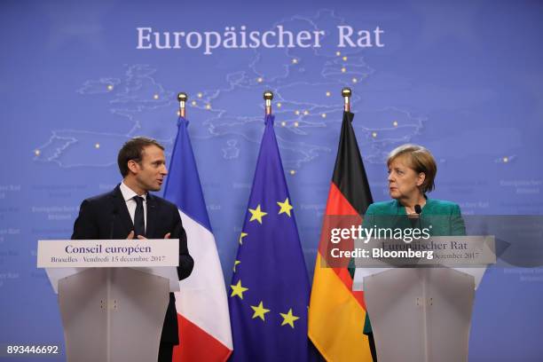 Emmanuel Macron, France's president, left, speaks as Angela Merkel, Germany's chancellor, looks on during a news conference at a summit of 27...