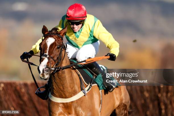 Bryan Cooper riding Sizing Tennessee clear the last to win The Horse Comes First Novices' Steeple Chase at Cheltenham racecourse on December 15, 2017...