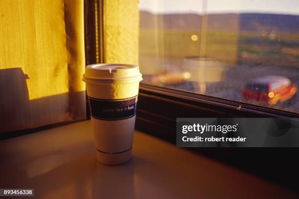 take away coffee cup sitting on window sill - kayenta region stock pictures, royalty-free photos & images