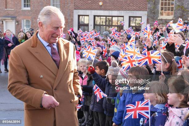 The Prince of Wales, Charles, tours Ramsbury Estate on December 15, 2017 in Marlborough, England. During his visit he met local school children and...