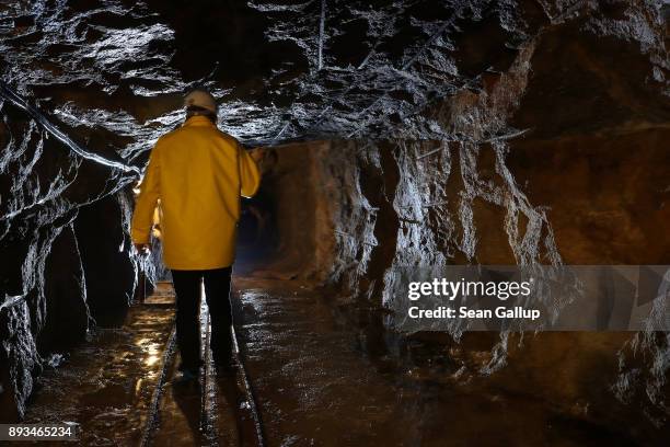 Thomas Dittrich, a geologist working for Deutsche Lithium GmbH, walks through a shaft rich in Zinnwaldite, a silicate mineral that contains lithium,...