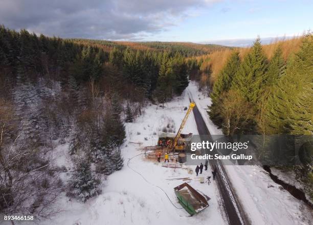 In this aerial view contract workers for Deutsche Lithium GmbH operate a machine taking mineral samples from 300 meters below the surface at a site...