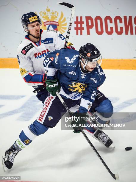 Finland's defender Jesse Virtanen fights for the puck with South Korea's forward Brock Radunske during the Channel One Cup of the Euro Hockey Tour...