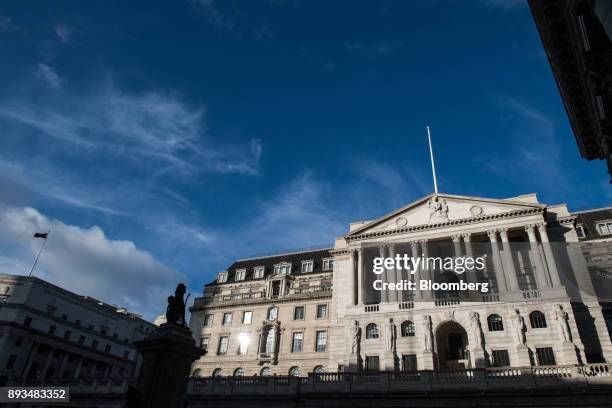 Sunlight reflects from a window in the Bank of England in the City of London, U.K., on Friday, Dec. 15, 2017. Bank of England policy makers said the...