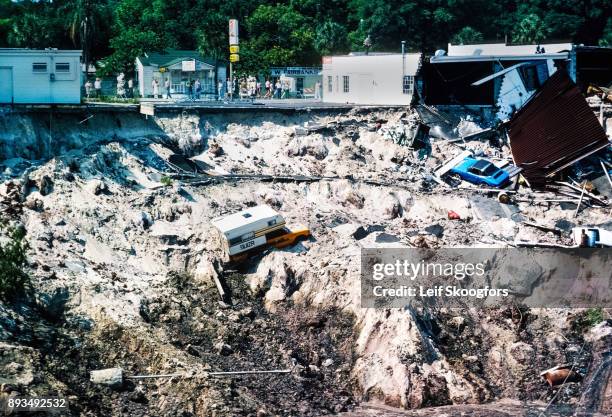 View of a large sinkhole, Winter Park, Florida, May 10, 1981. Appearing the previous day, it was approximately 300 feet wide and 80 feet deep , it...