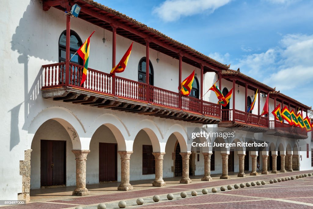 Flags of Cartagena at historical facade of town hall "Alcaldia Mayor"