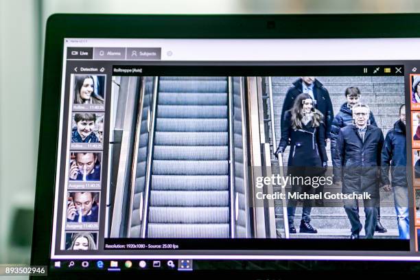 German Interior Minister Thomas de Maiziere is seen on the screen of one of thee monitoring systems during his visit to a project for automatic...