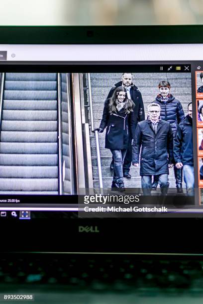 German Interior Minister Thomas de Maiziere is seen on the screen of one of thee monitoring systems during his visit to a project for automatic...
