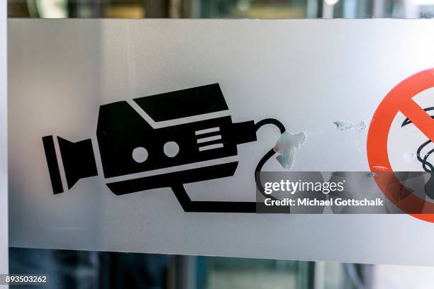 Pictogram of a security camera indicates the area for automatic recognition of faces at trainstation Suedkreuz on December 15, 2017 in Berlin,...