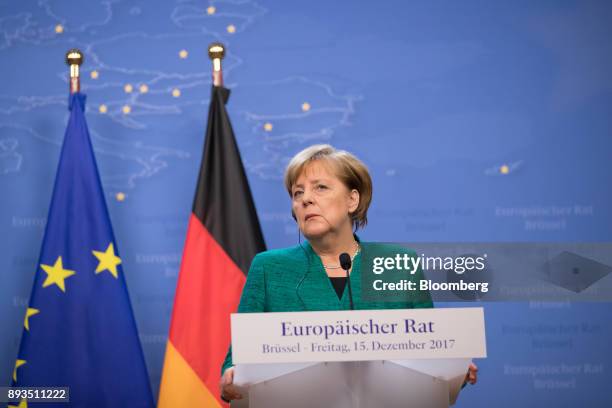 Angela Merkel, Germany's chancellor, looks on during a news conference at a summit of 27 European Union leaders in Brussels, Belgium, on Friday, Dec....