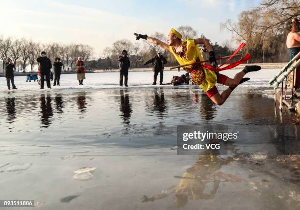 Winter swimming enthusiast dressed like Monkey King jumps into the cold waters of Beiling Park on December 15, 2017 in Shengyang, Liaoning Province...