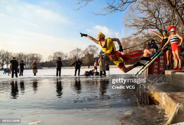 Winter swimming enthusiast dressed like Monkey King jumps into the cold waters of Beiling Park on December 15, 2017 in Shengyang, Liaoning Province...