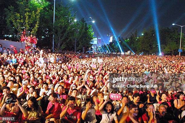 Thousands of South Korean soccer fans cheer during a festival to celebrate the success of the South Korean team taking fourth place in the 2002 World...