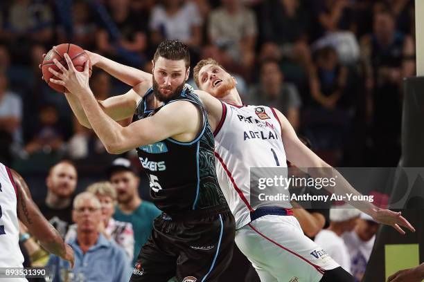 Alex Pledger of the Breakers competes for a rebound against Matt Hodgson of the 36ers during the round 10 NBL match between the New Zealand Breakers...