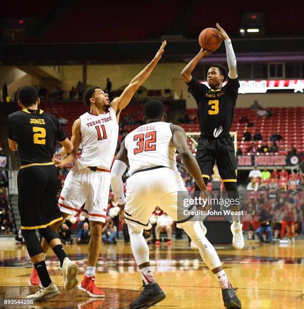 James Scott of the Kennesaw State Owls shoots the ball over Zach Smith of the Texas Tech Red Raiders during the game on December 13, 2017 at United...