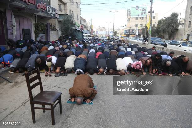 Palestinians perform Friday Prayer as they gather to stage a protest against U.S. President Donald Trumps announcement to recognize Jerusalem as the...