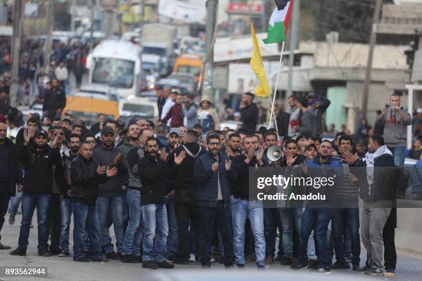 Palestinians gather to stage a protest against U.S. President Donald Trumps announcement to recognize Jerusalem as the capital of Israel and plans to...