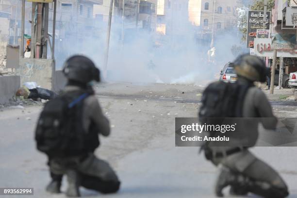 Israeli security forces intervene Palestinians as they gather to stage a protest against U.S. President Donald Trumps announcement to recognize...