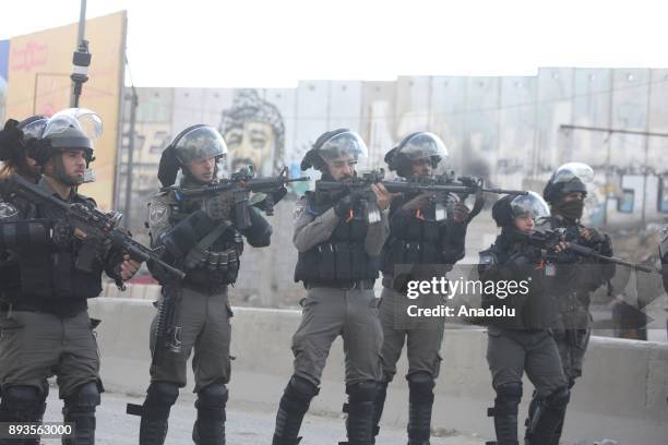 Israeli security forces intervene Palestinians as they gather to stage a protest against U.S. President Donald Trumps announcement to recognize...