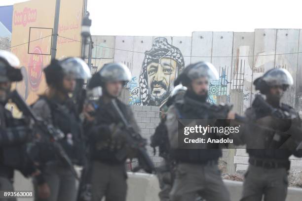 Israeli security forces intervene Palestinians as they gather to stage a protest against U.S. President Donald Trumps announcement to recognize...