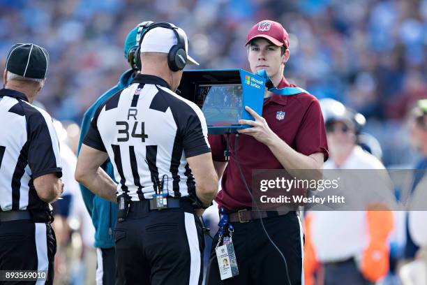 Referee Clete Blakeman watches a replay during a game between theTennessee Titans and the Houston Texans at Nissan Stadium on December 3, 2017 in...