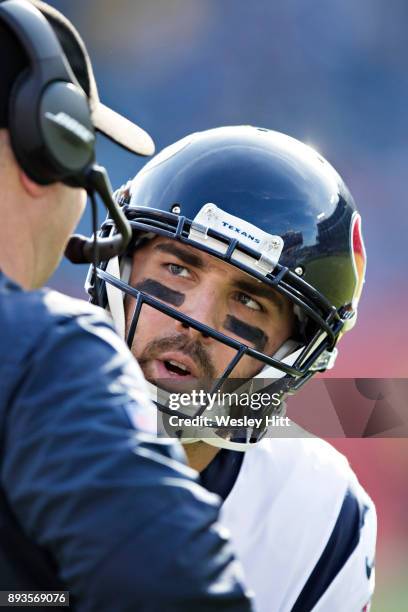 Head Coach Bill O'Brien talks with Tom Savage of the Houston Texans during a timeout during a game against the Tennessee Titans at Nissan Stadium on...