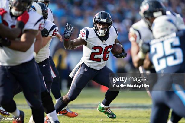 Lamar Miller of the Houston Texans runs the ball during a game against the Tennessee Titans at Nissan Stadium on December 3, 2017 in Nashville,...