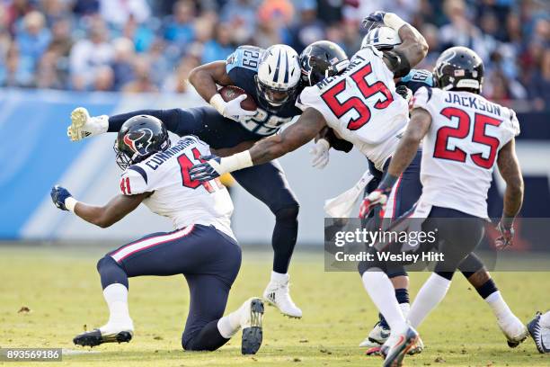 DeMarco Murray of the Tennessee Titans attempts to jump over Zach Cunningham of the Houston Texans at Nissan Stadium on December 3, 2017 in...