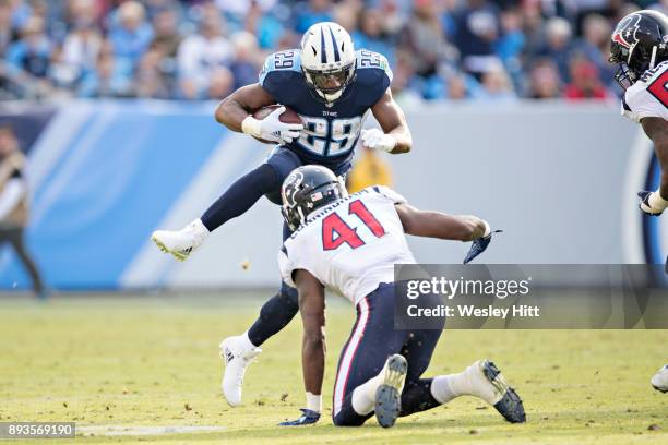 DeMarco Murray of the Tennessee Titans attempts to jump over Zach Cunningham of the Houston Texans at Nissan Stadium on December 3, 2017 in...