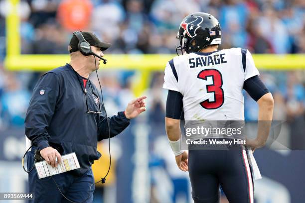 Head Coach Bill O'Brien talks with Tom Savage of the Houston Texans during a timeout during a game against the Tennessee Titans at Nissan Stadium on...