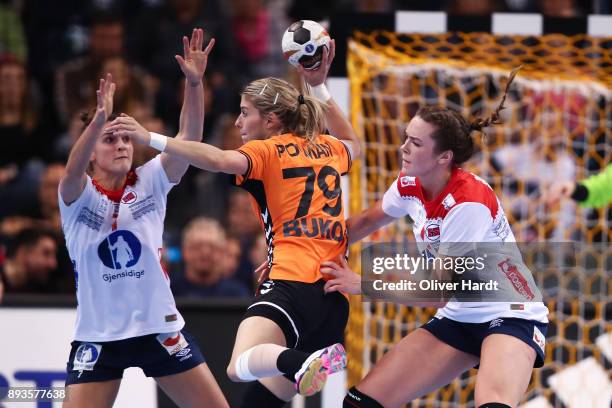 Estavana Polman of Netherlands and Kari Brattset of Norway challenges for the ball during the Championship Semi Final between match between...