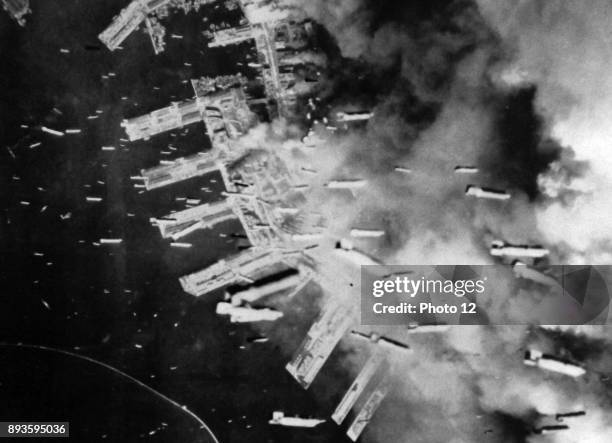 The Japanese port of Kobe is bombed by US aircraft in March 1945.