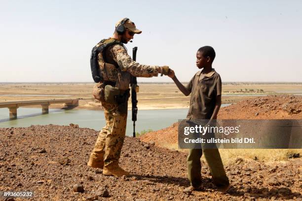 Germans on patrol in Gao trying to win the hearts and minds of the local children