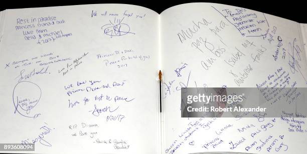 Visitors to a memorial to Princess Diana and Dodi Fayed at Harrods department store in London, England, can sign and express their thoughts in a...