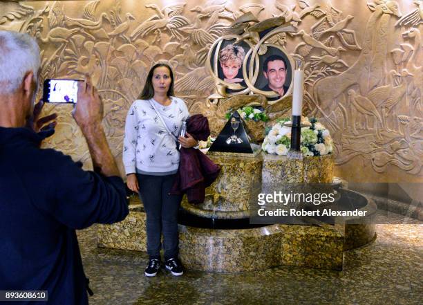 Tourists take souvenir photographs at a memorial to Princess Diana and Dodi Fayed at Harrods department store in London, England. The memorial was...
