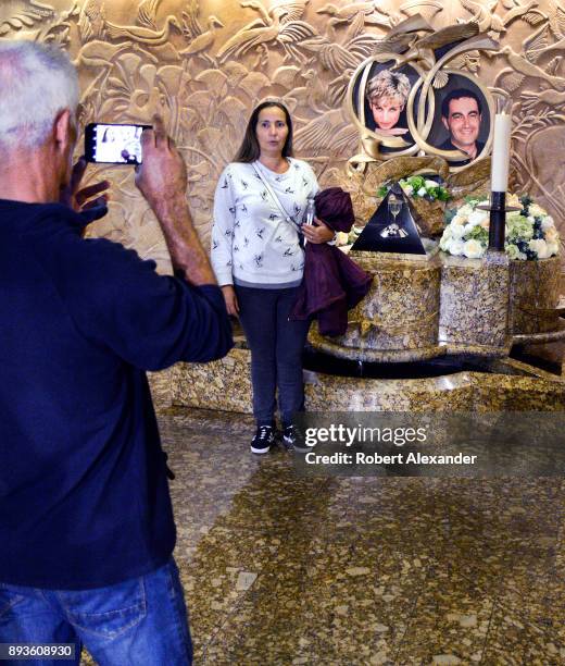 Tourists take souvenir photographs at a memorial to Princess Diana and Dodi Fayed at Harrods department store in London, England. The memorial was...