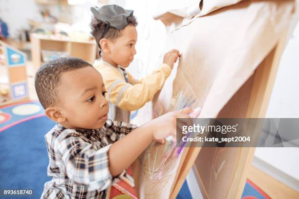 two busy kids - preschool art stock pictures, royalty-free photos & images
