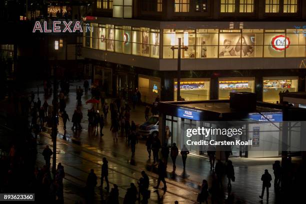 Passers-by pass a new police station at Alexanderplatz on December 15, 2017 in Berlin, Germany. Alexanderplatz, at the heart of Berlin, has seen a...