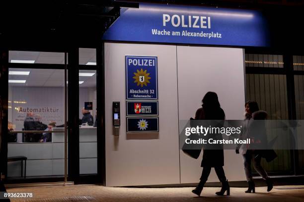 Passers-by pass a new police station at Alexanderplatz on December 15, 2017 in Berlin, Germany. Alexanderplatz, at the heart of Berlin, has seen a...