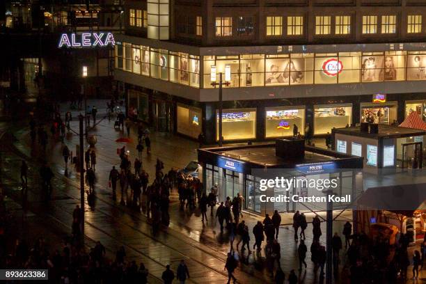 Passers-by pass a new police station at Alexanderplatz on December 15, 2017 in Berlin, Germany. Alexanderplatz, at the heart of Berlin, has seen a...