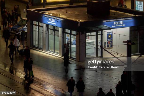 Passers-by pass a new police station at Alexanderplatz on December 15, 2017 in Berlin, Germany. Alexanderplatz, at the heart of Berlin, has seen a...